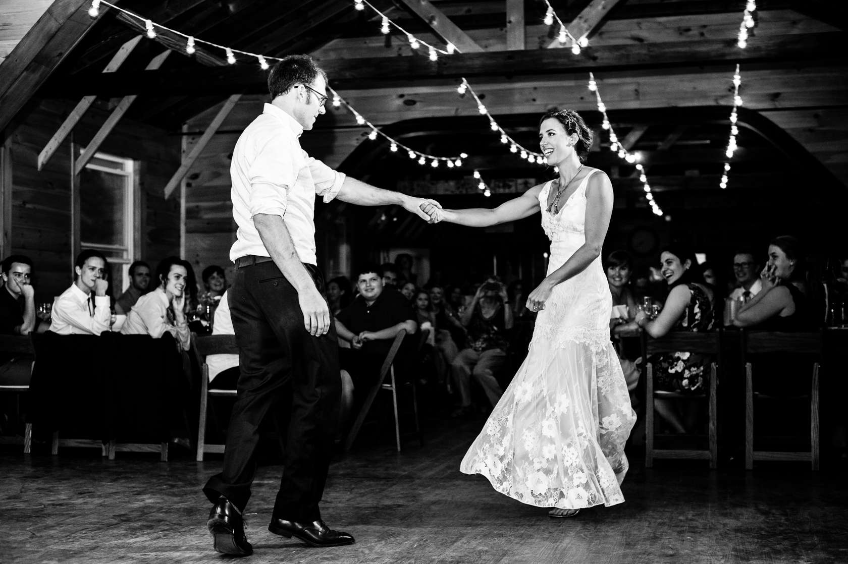 bride and groom laughing during their dynamic first dance 