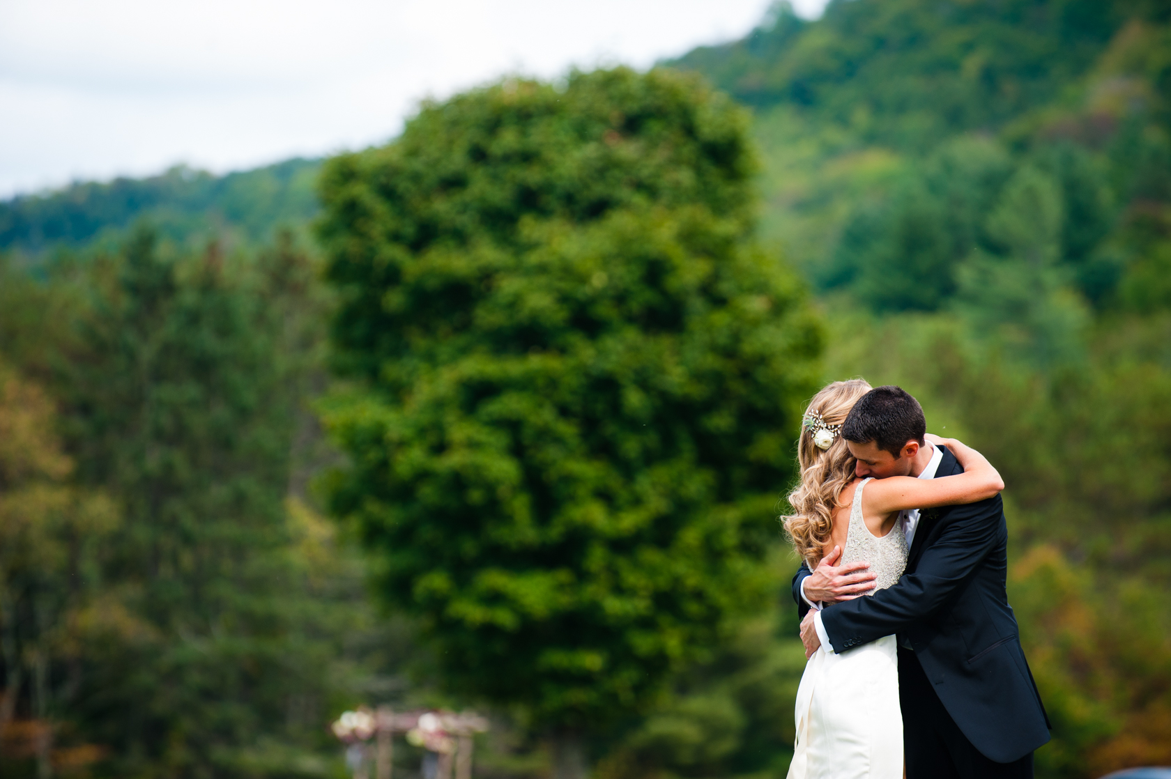 bride and groom hugging after seeing each other for the first time