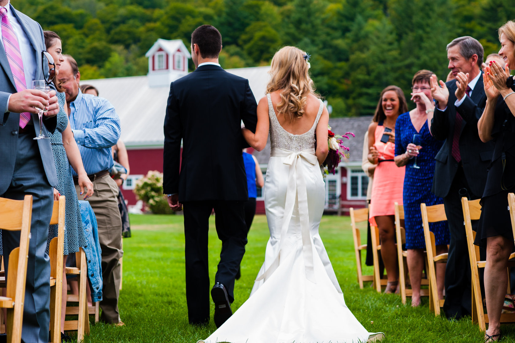 bride and groom walk down the aisle after their wedding ceremony 