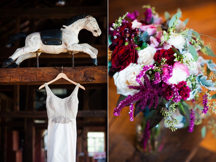 lace wedding gown hangs in dark wood barn next to gorgeous pink bouquet