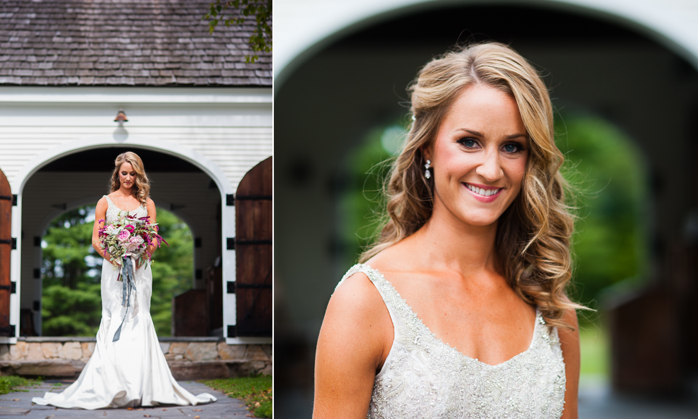 gorgeous bride in front of white barn 