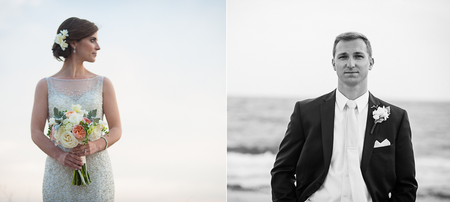 bride stands with her bouquet and groom smiles at camera with ocean behind