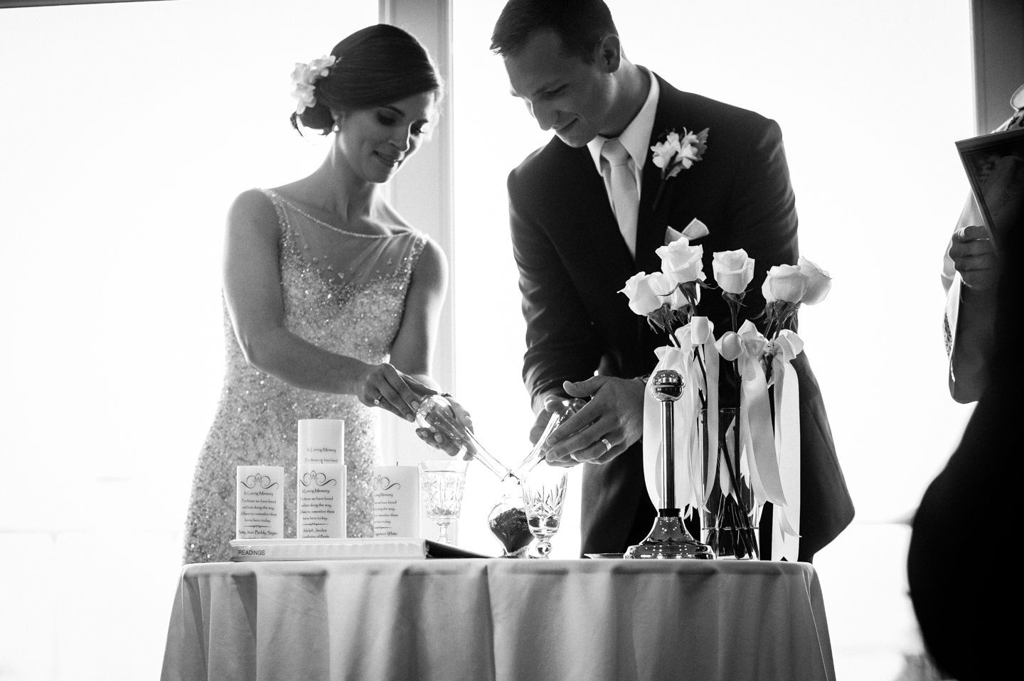 bride and groom light a unity candle 