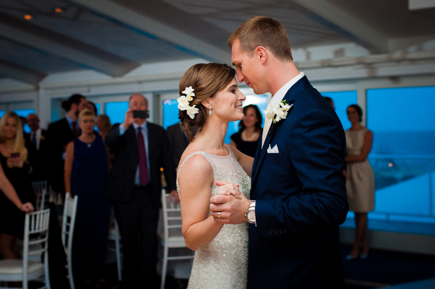 bride and groom smiling at each other during their first dance 