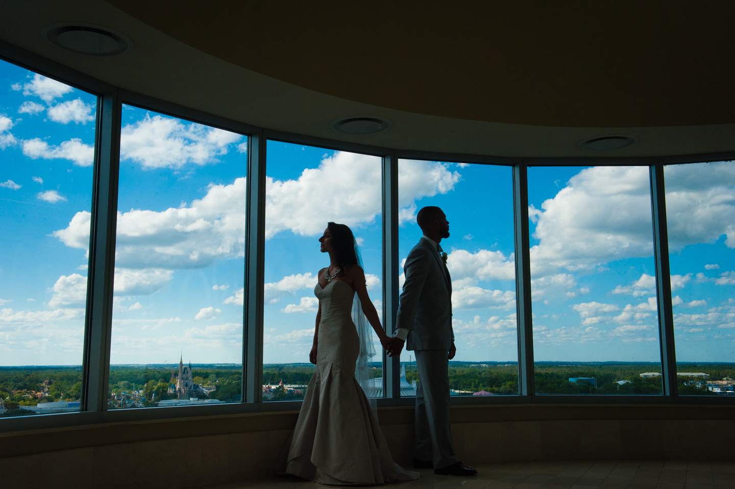 Cinderellas castle in background of  bride and groom first look