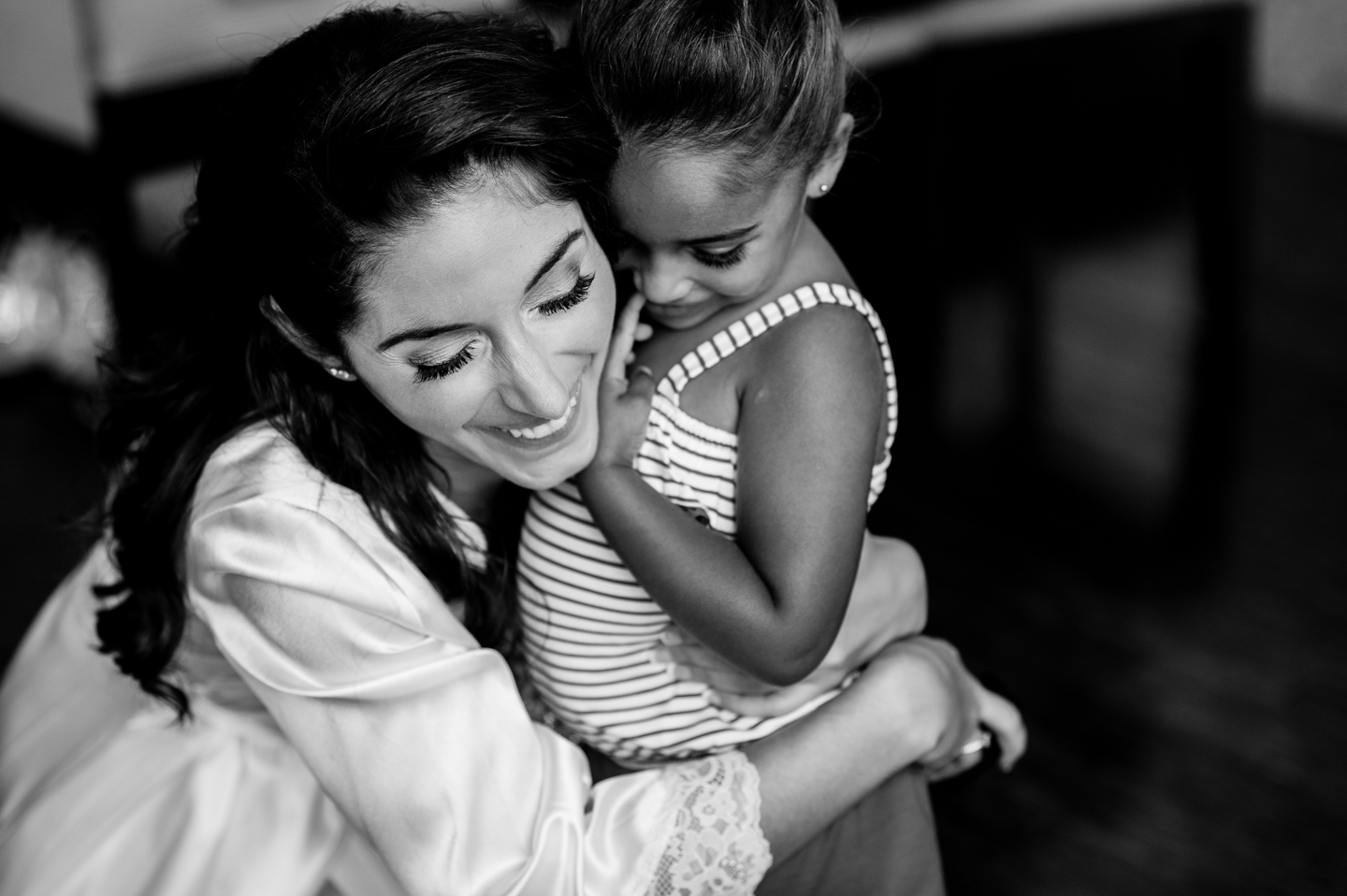 emotional moment between bride and flower girl 