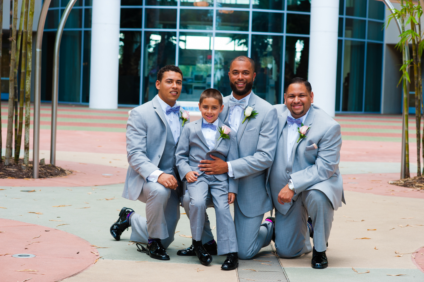 handsome groom pose with groomsmen outside disney contemporary resort 
