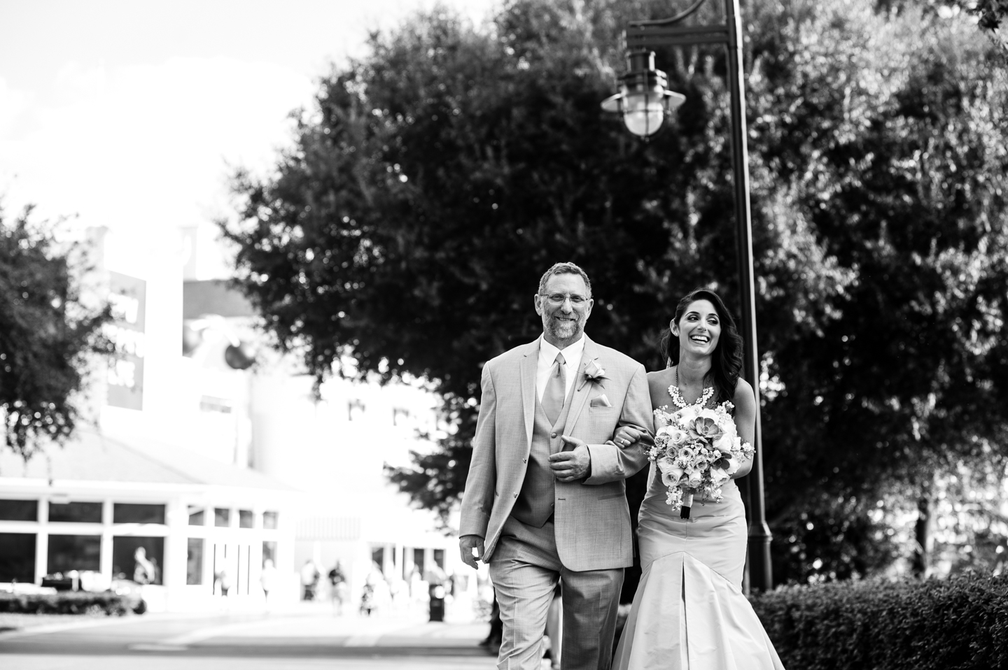 stunning bride and her father walk to her disney wedding ceremony 