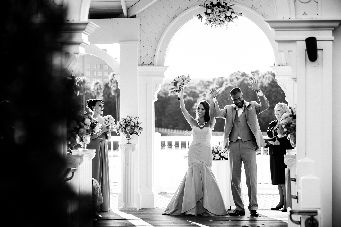 bride and groom cheering at the end of their wedding ceremony 