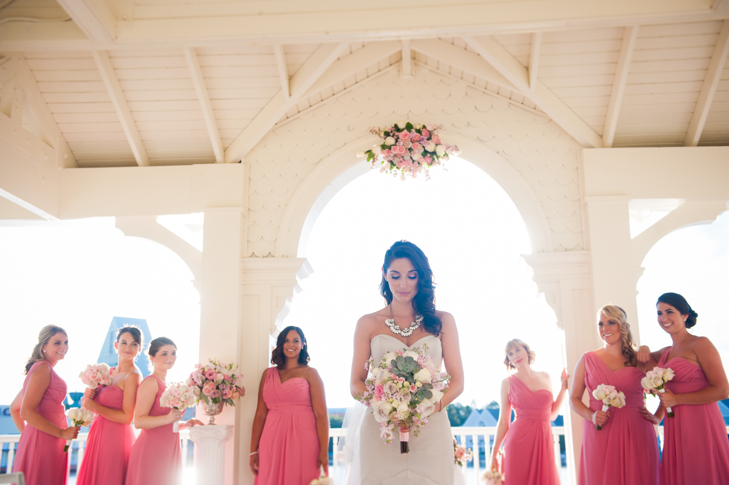 bride looks at her beautiful bouquet 