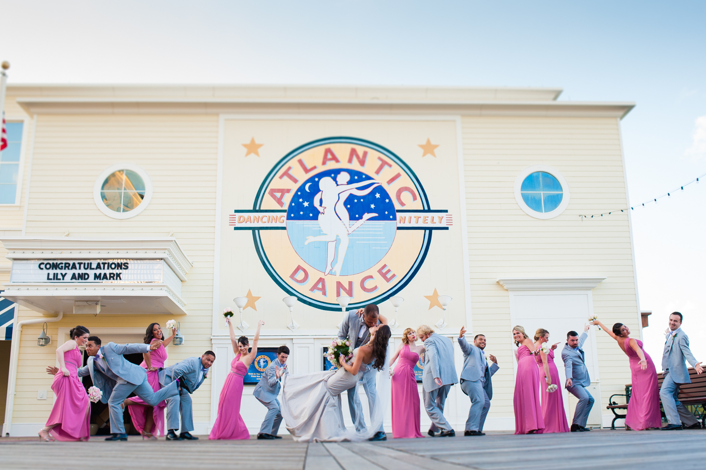 wedding party goofs off in front of atlantic dance hall 