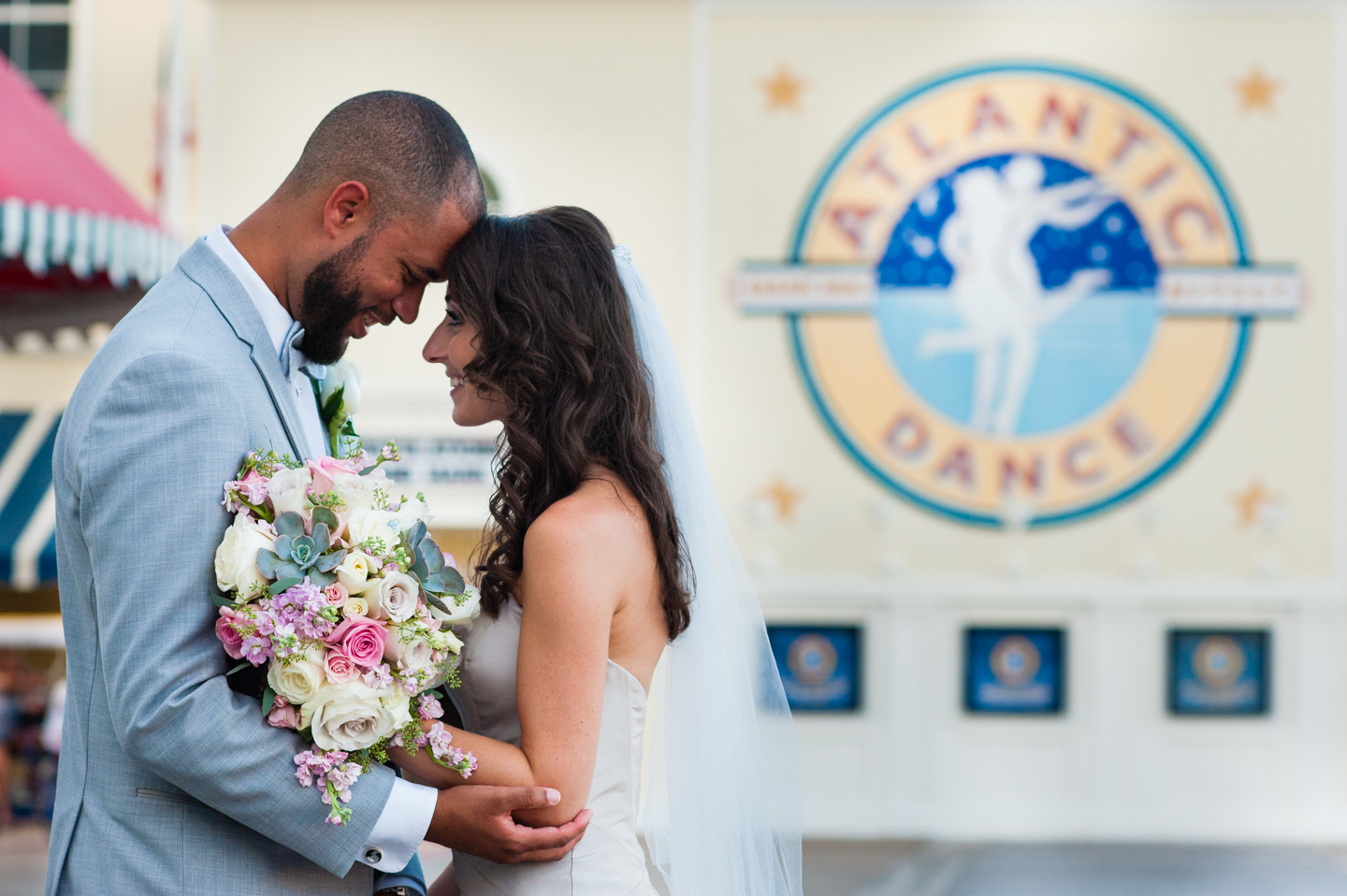 stunning couple embraces during portraits atlantic dance hall wedding 