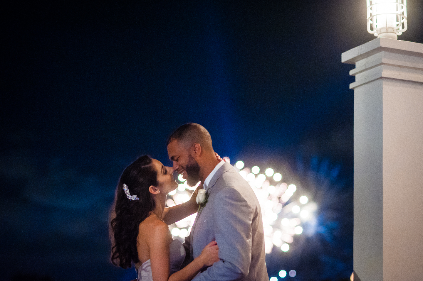 epcot fireworks newly married couple kiss from balcony of atlantic dance hall 