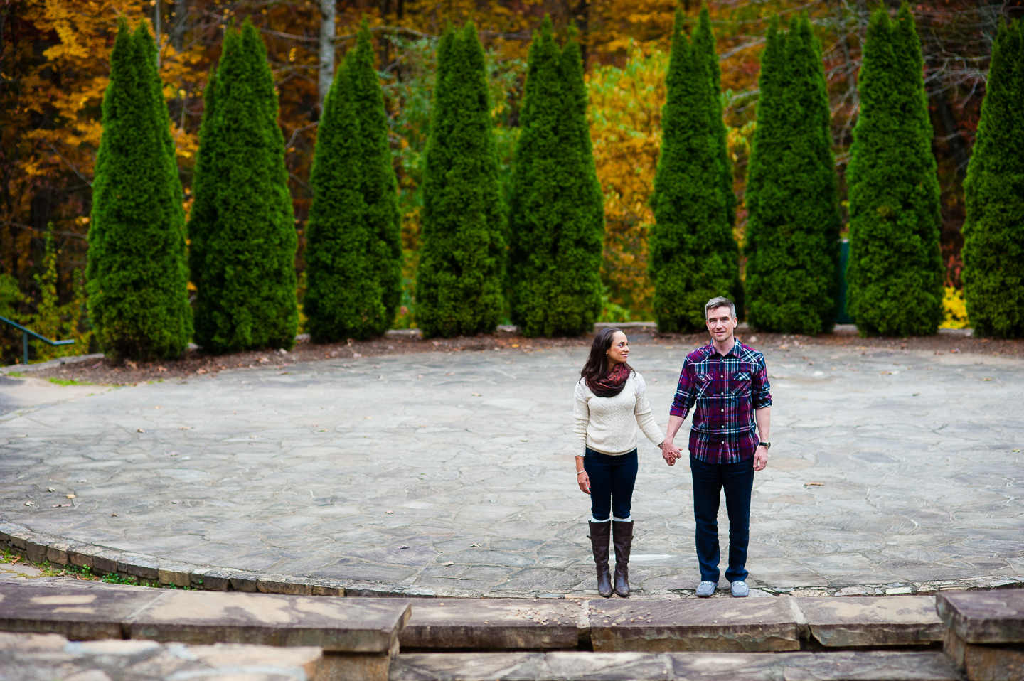 stylish couple at nc arboretum amphitheater steps  