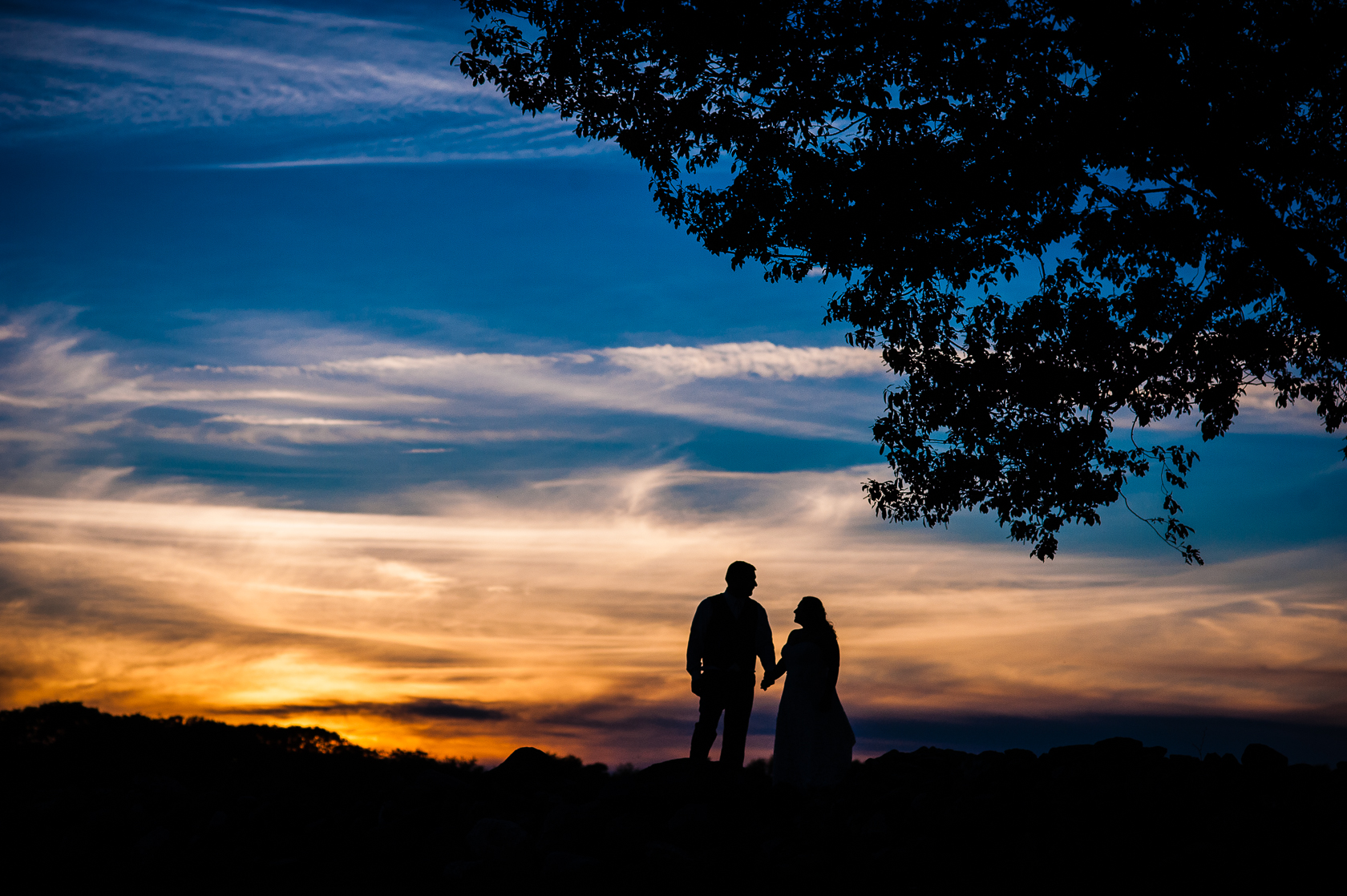 gorgeous sunset silhouette of couple