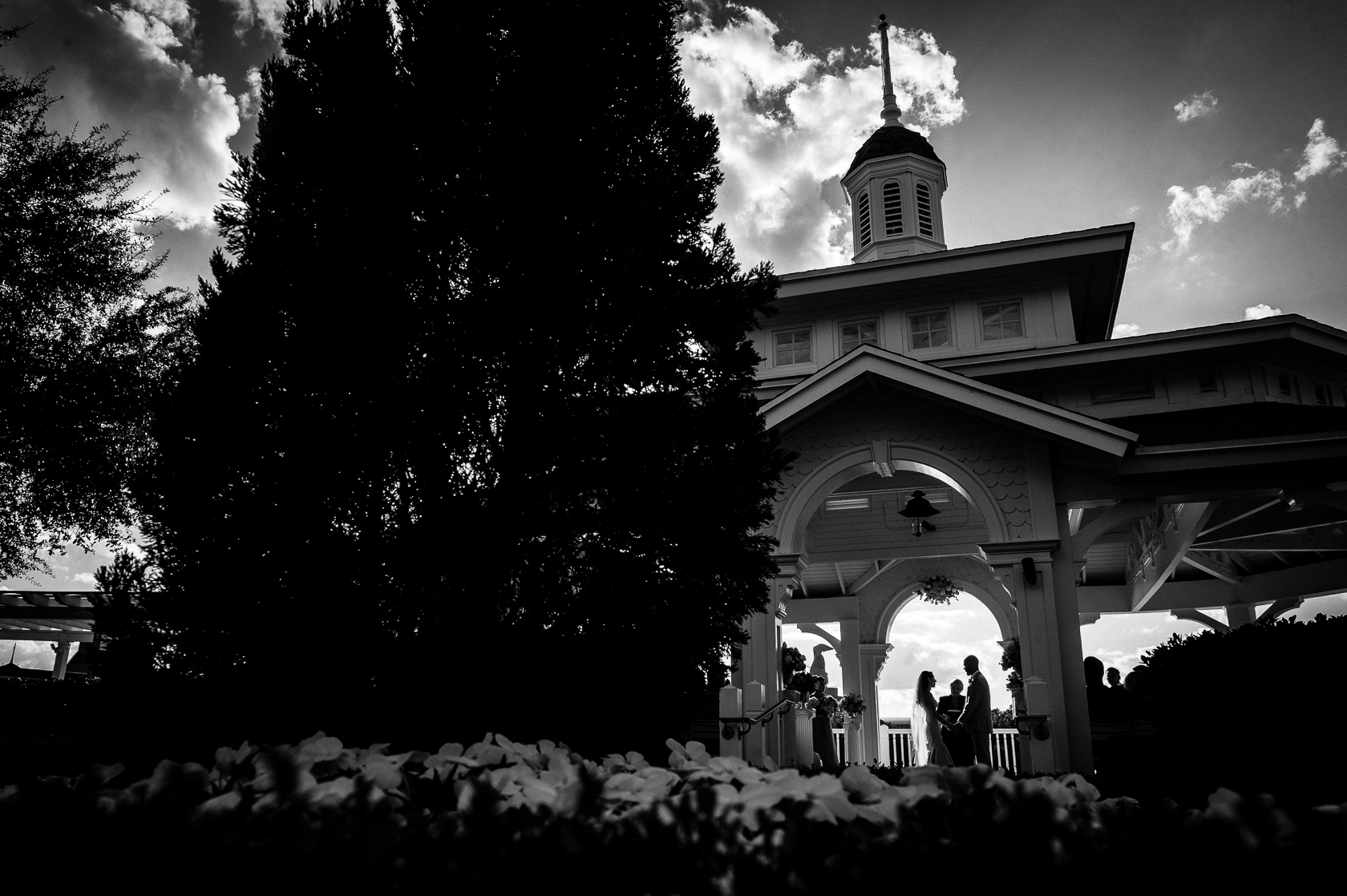 silhouette of couple at Seabreeze point during disney world wedding 