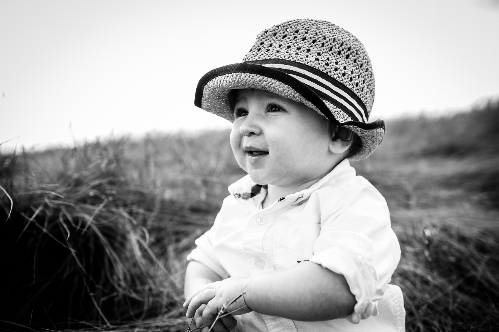 adorable little boy poses for baby portraits