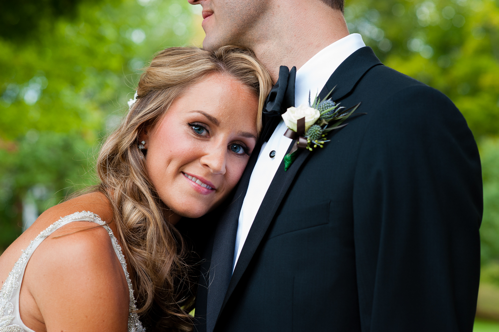 pretty bride smiles during asheville summer camp wedding 