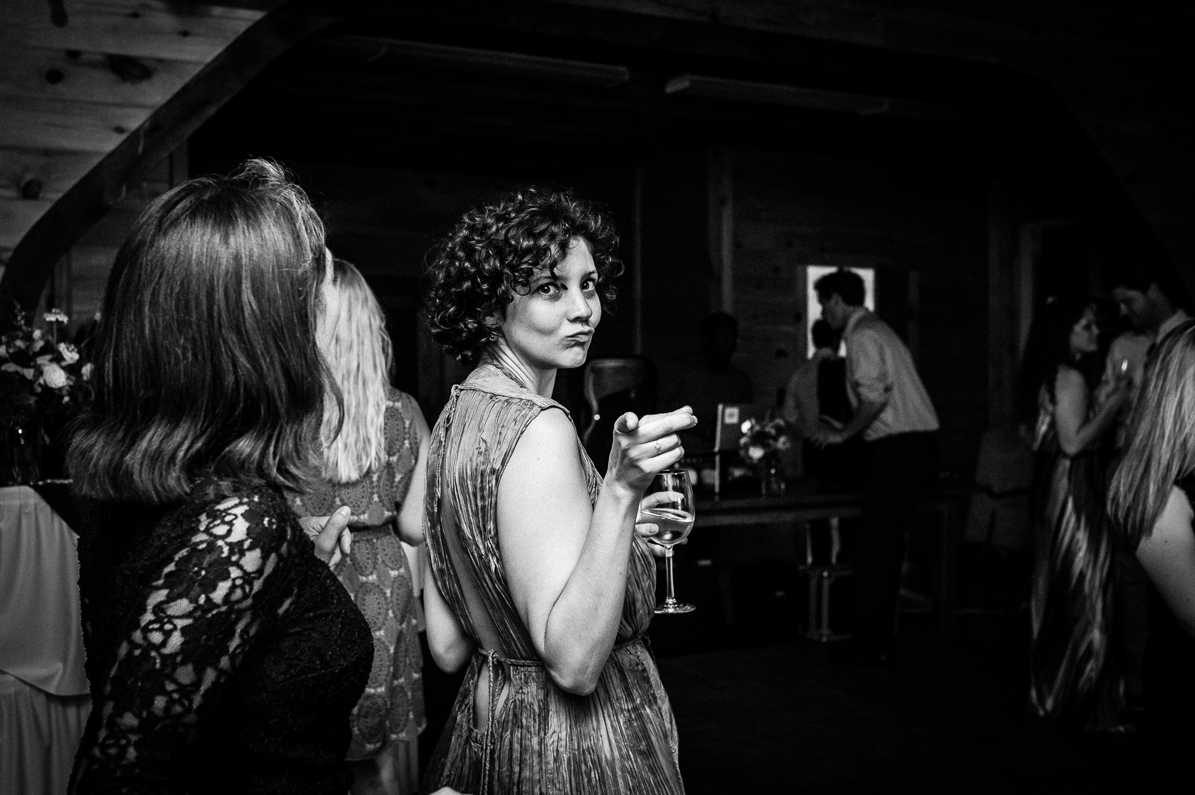 wedding guest making eyes at camera during asheville barn wedding 