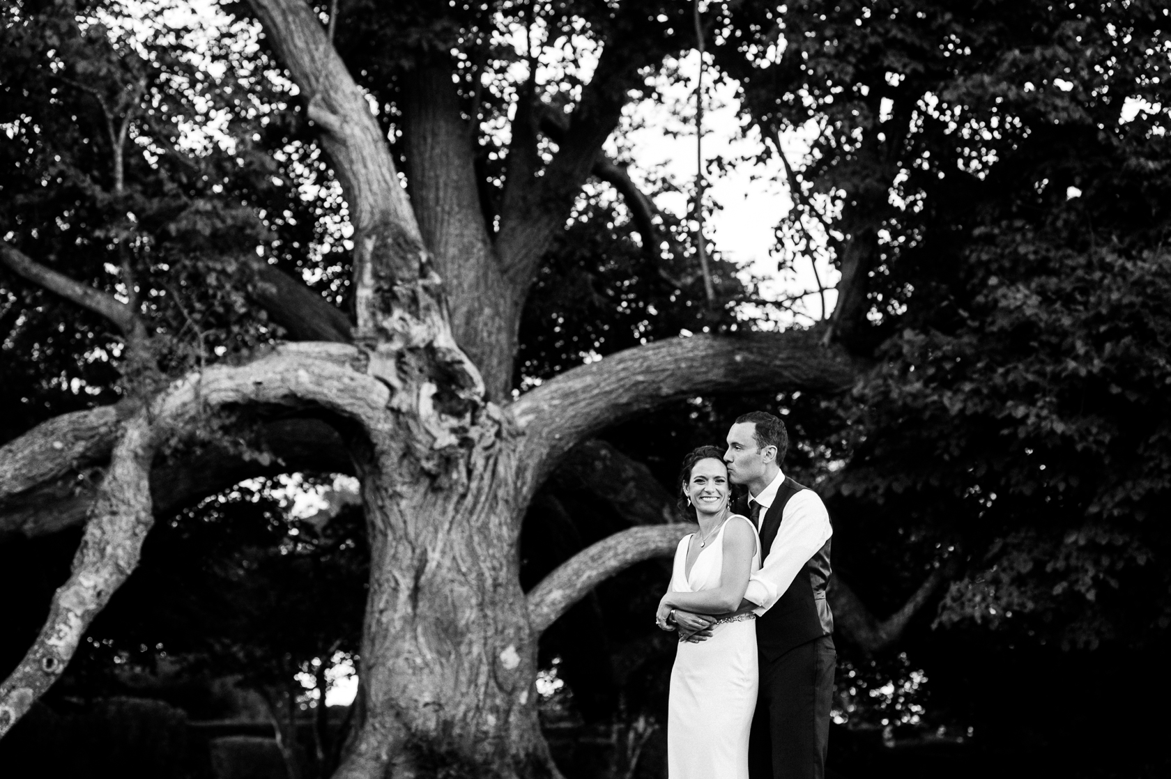 bride and groom portrait by big oak tree