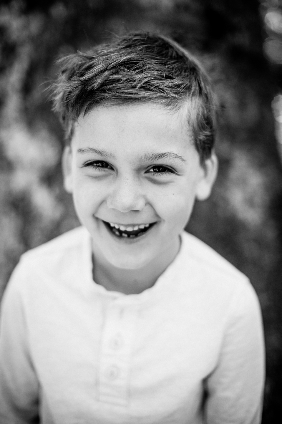 handsome boy smiles for environmental portrait 