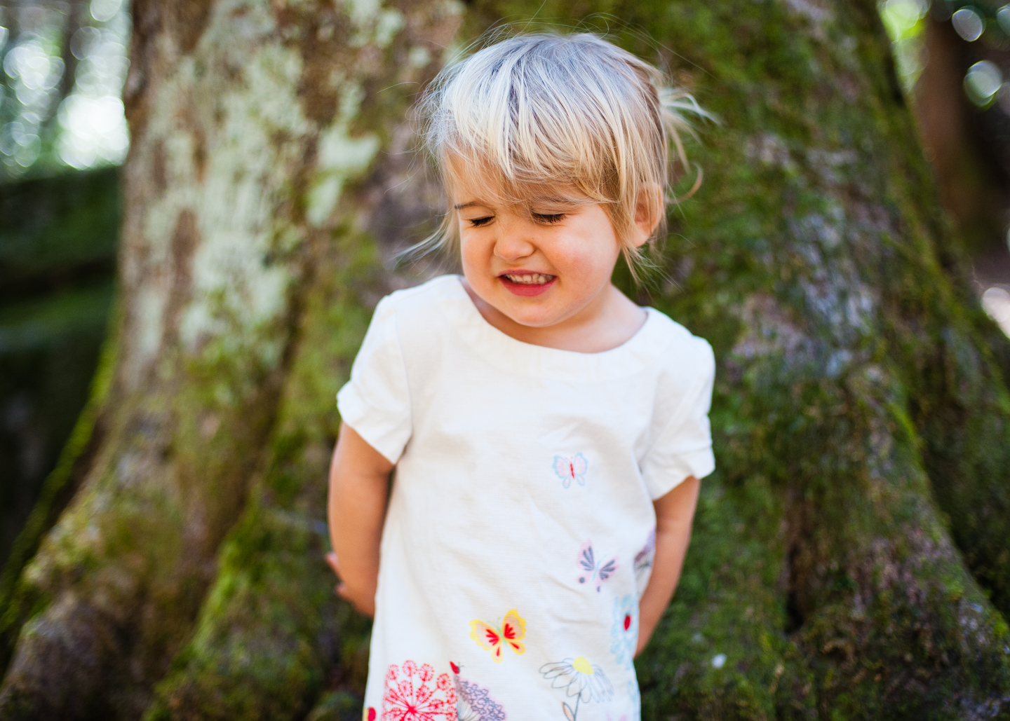 adorable toddler makes silly face during boone adventure portrait session 