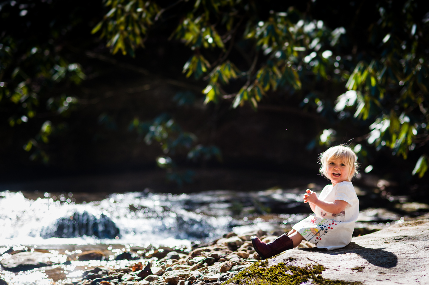 gorgeous toddler during her adventure photography session by a stream 