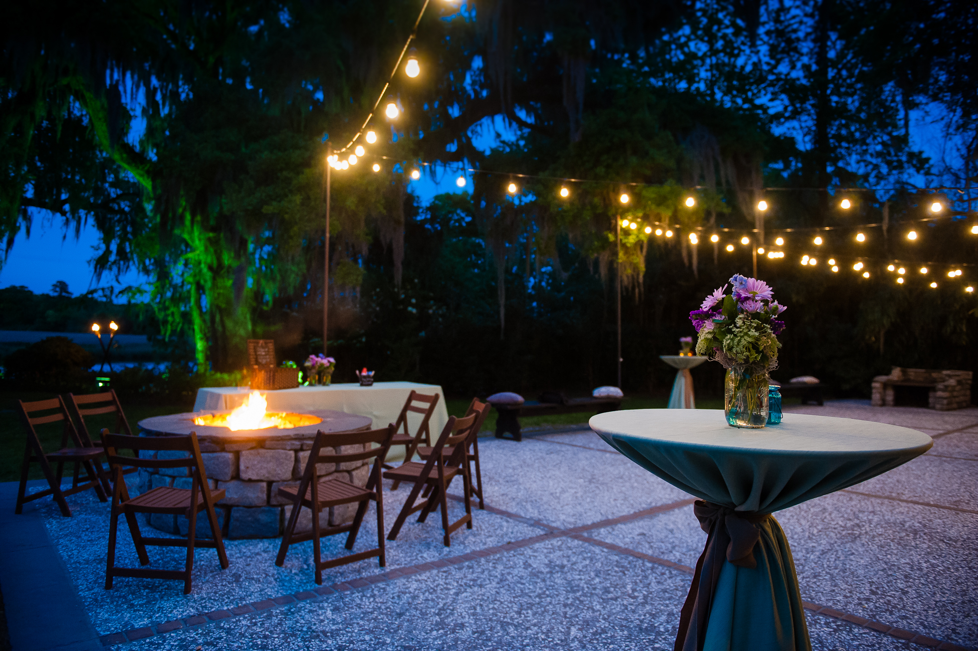 Magnolia Plantation carriage house wedding lit up at night 