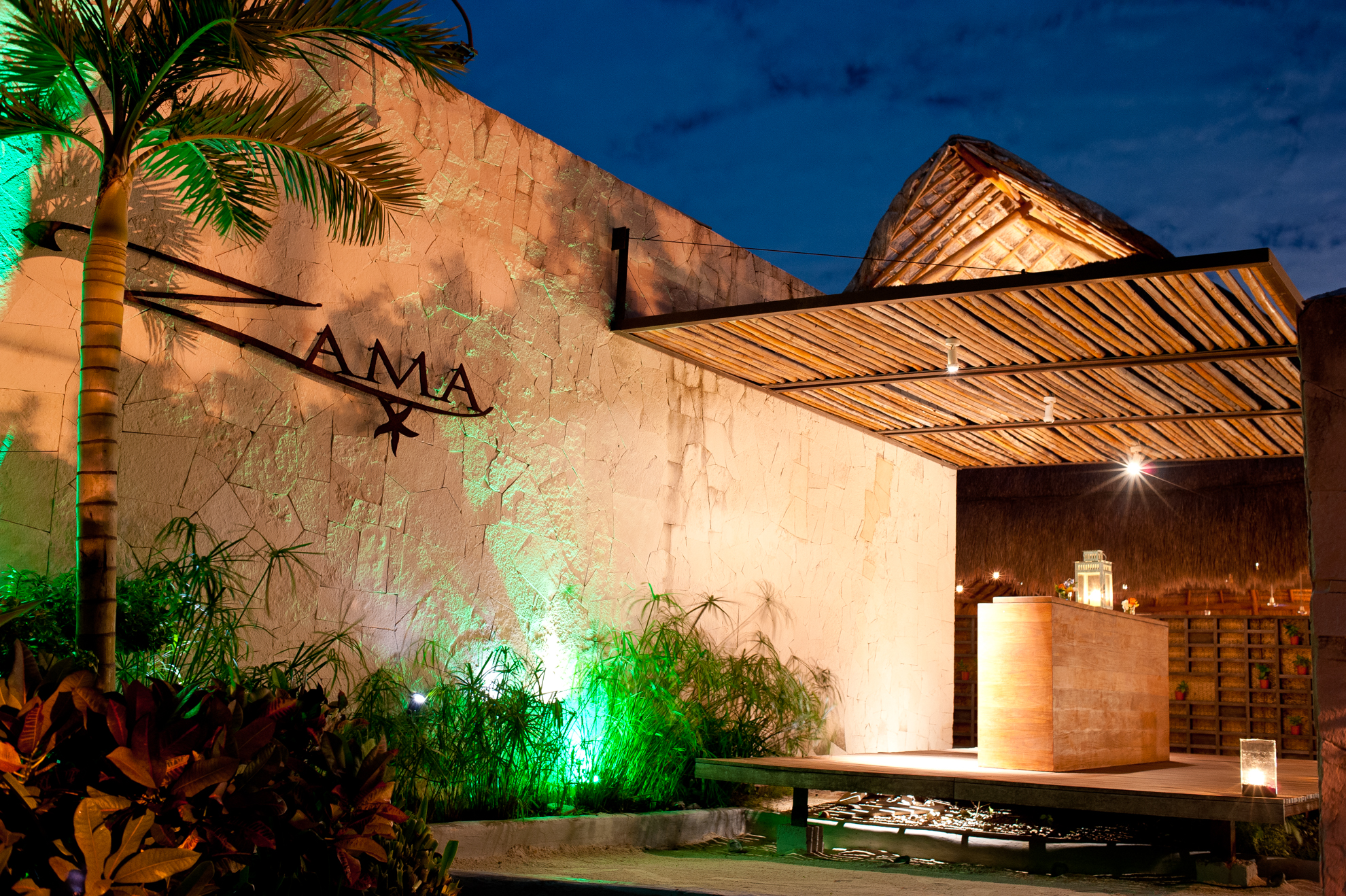 Zama Beach club lit up at night 