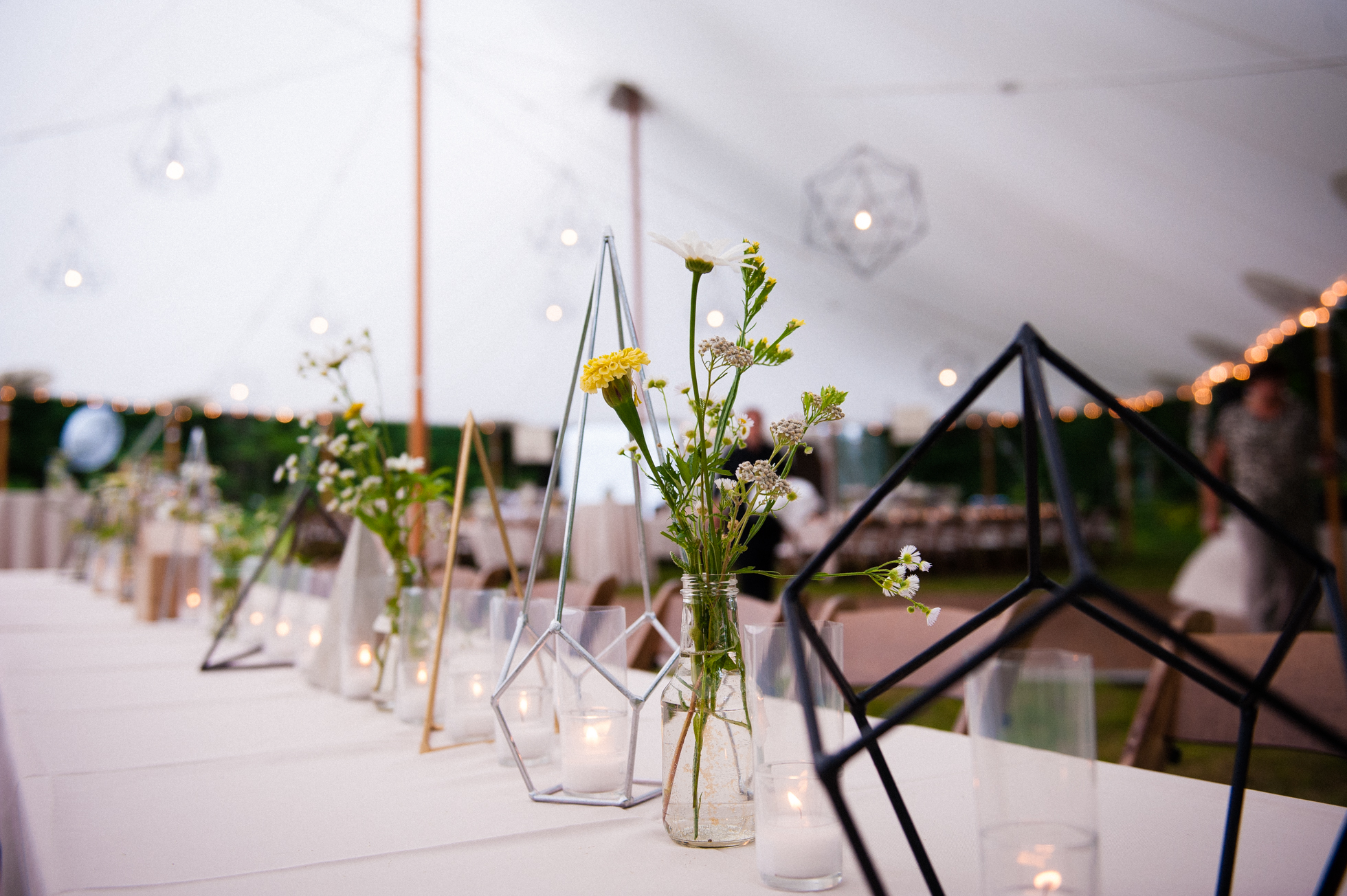 custom centerpieces during asheville tented wedding 