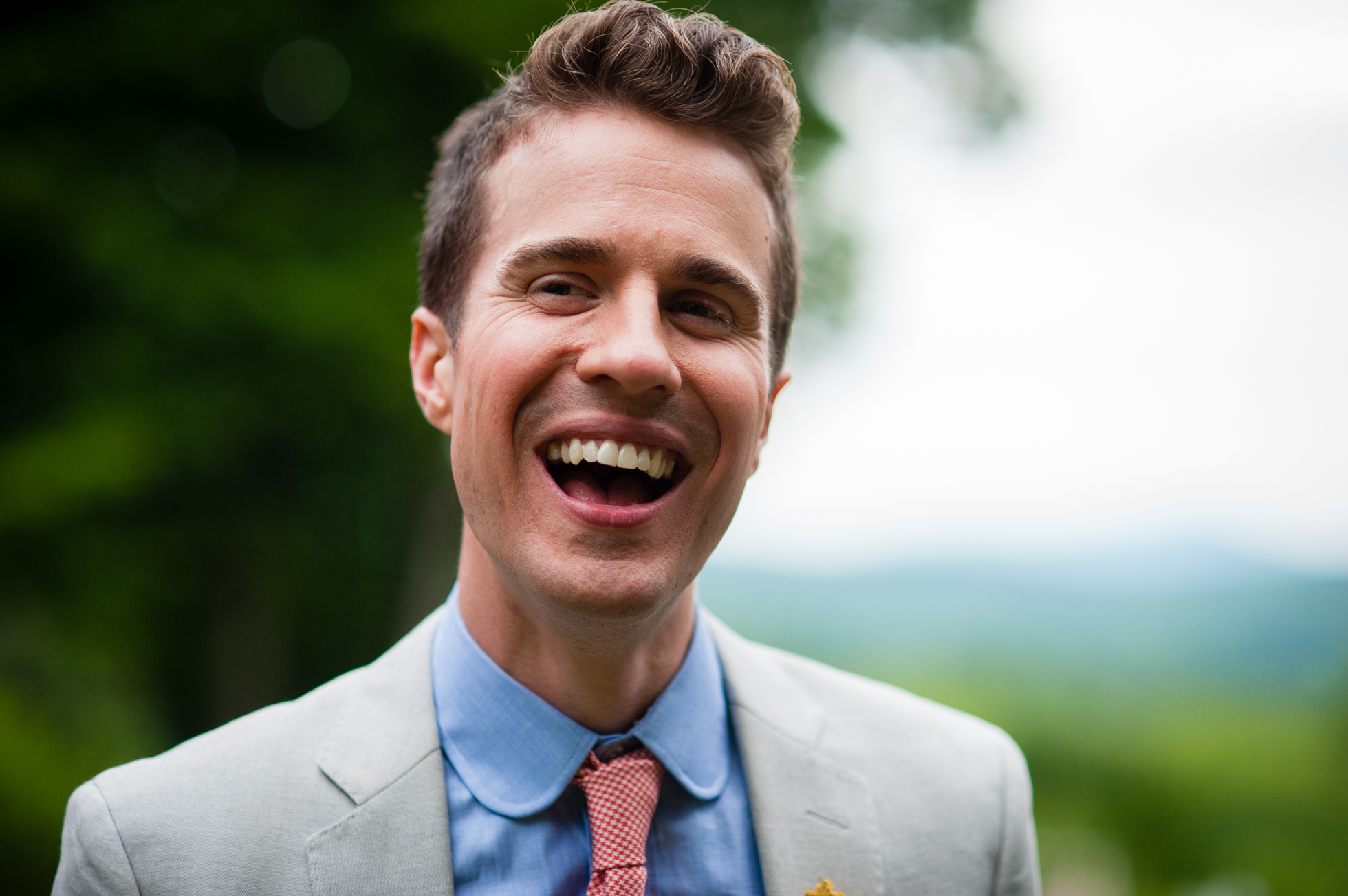 asheville same sex wedding groom laughing