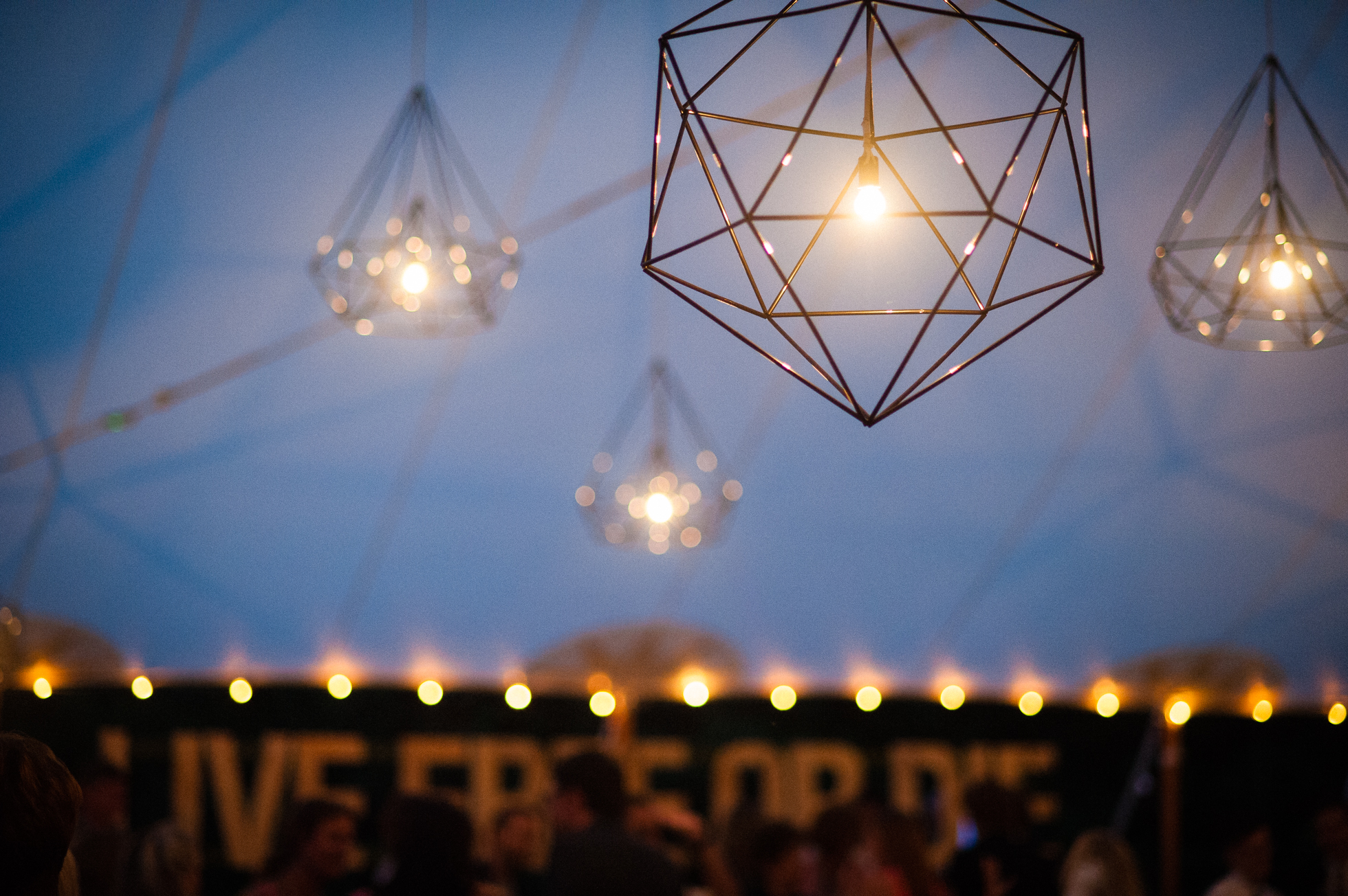 handmade gorgeous lanterns hung from sailcloth tent