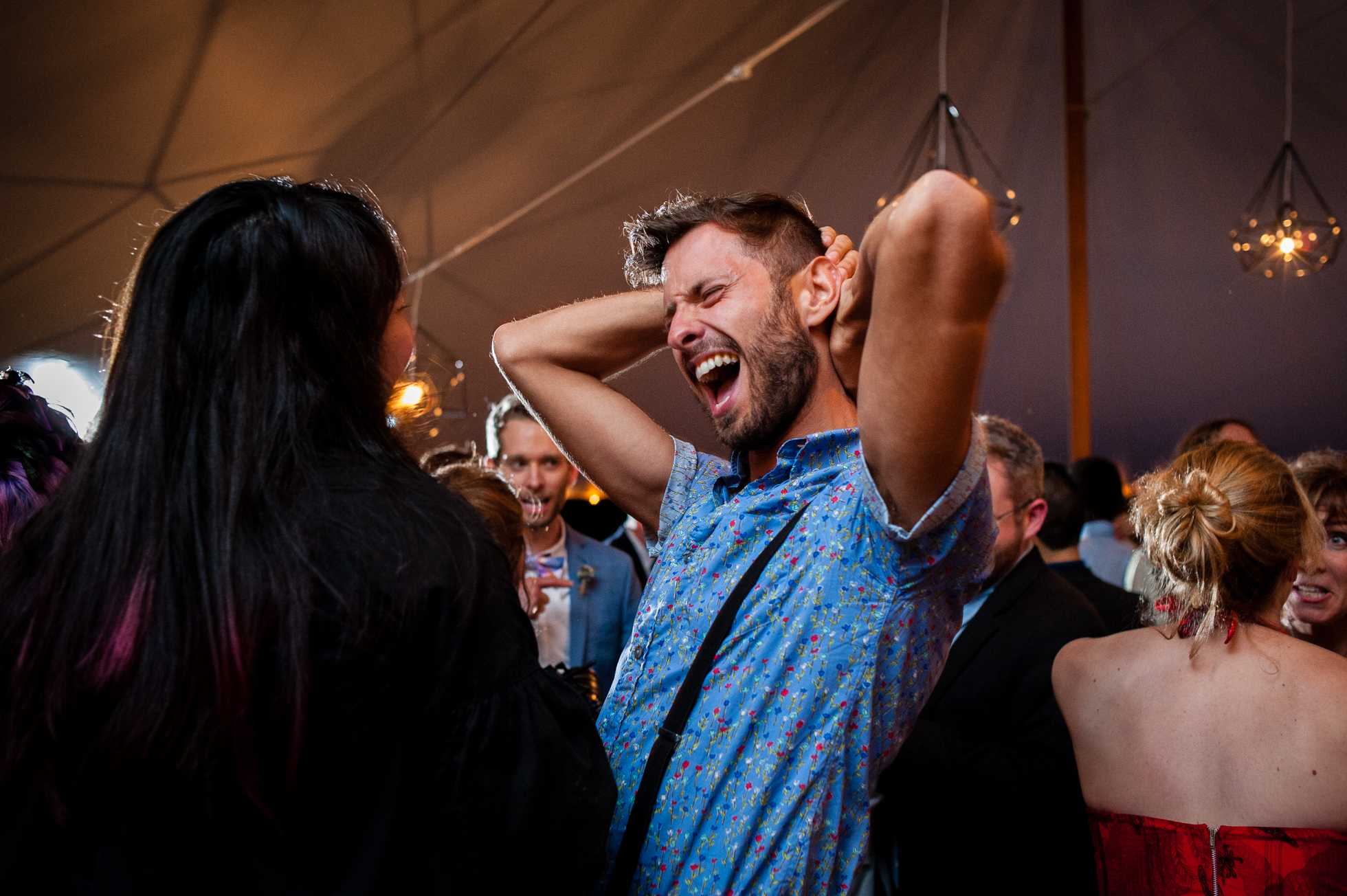 wedding guests dancing during backyard asheville wedding