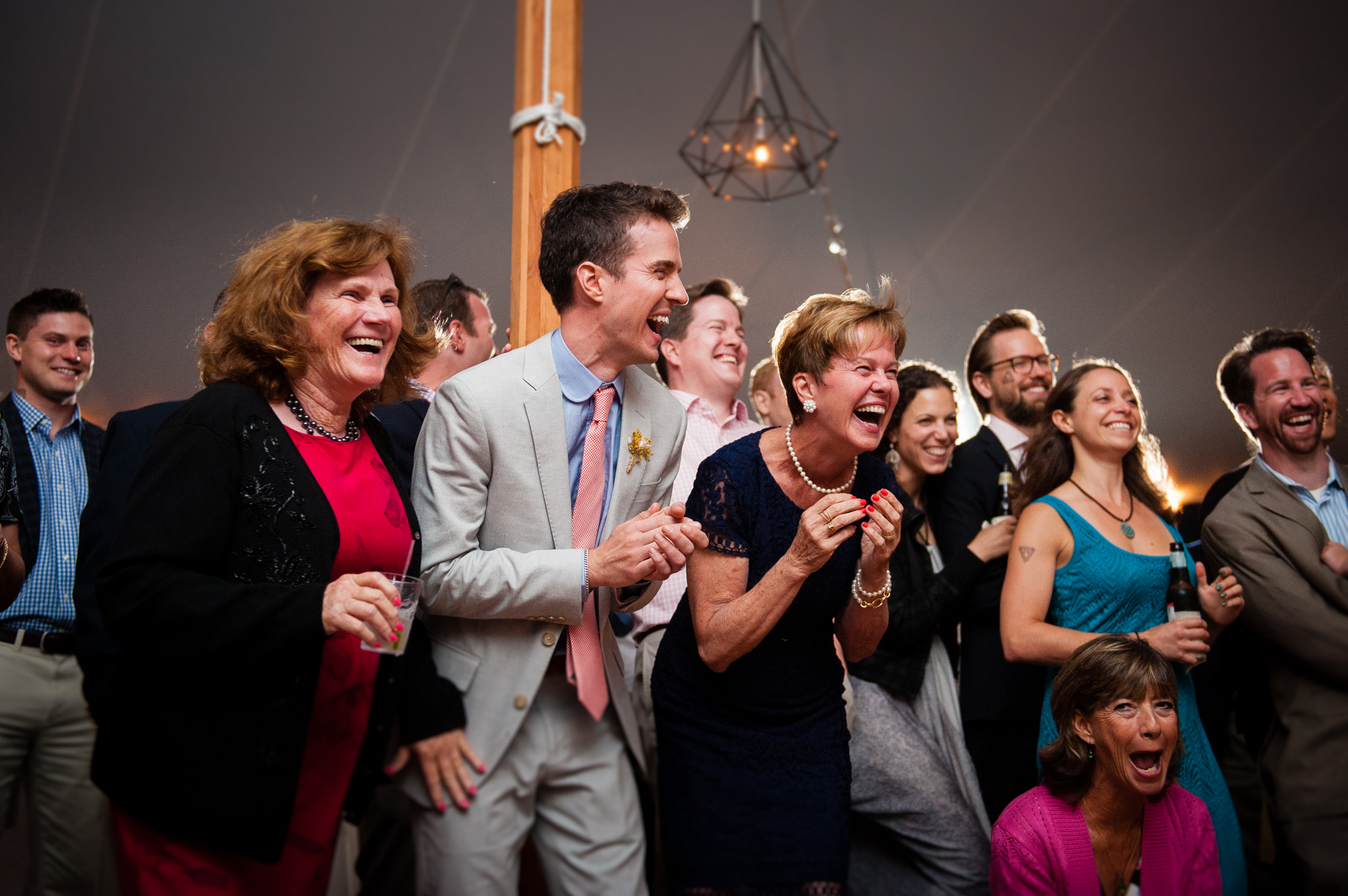 wedding guests laughing at dancers