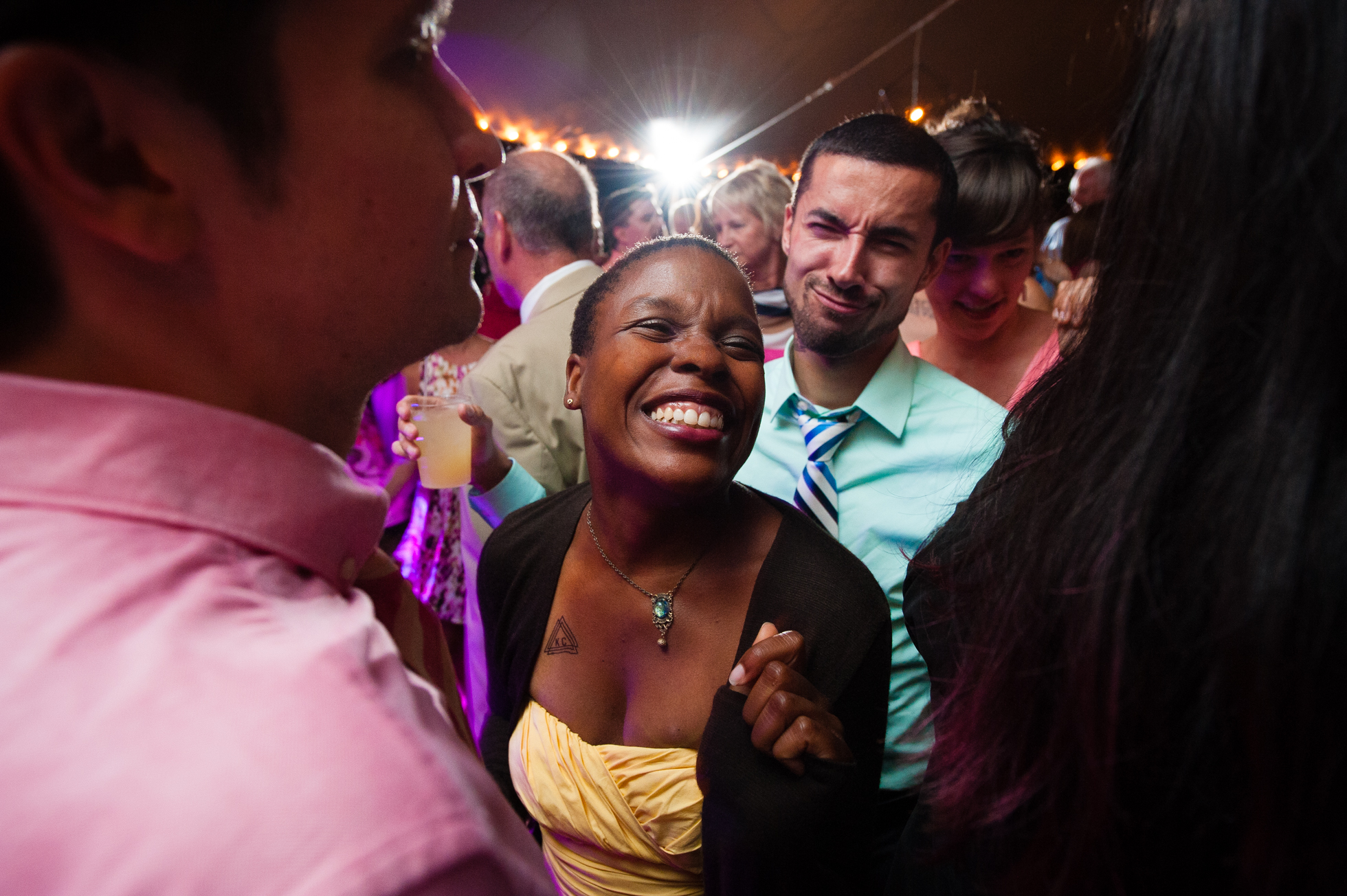 wedding guests on dancefloor during asheville tented wedding