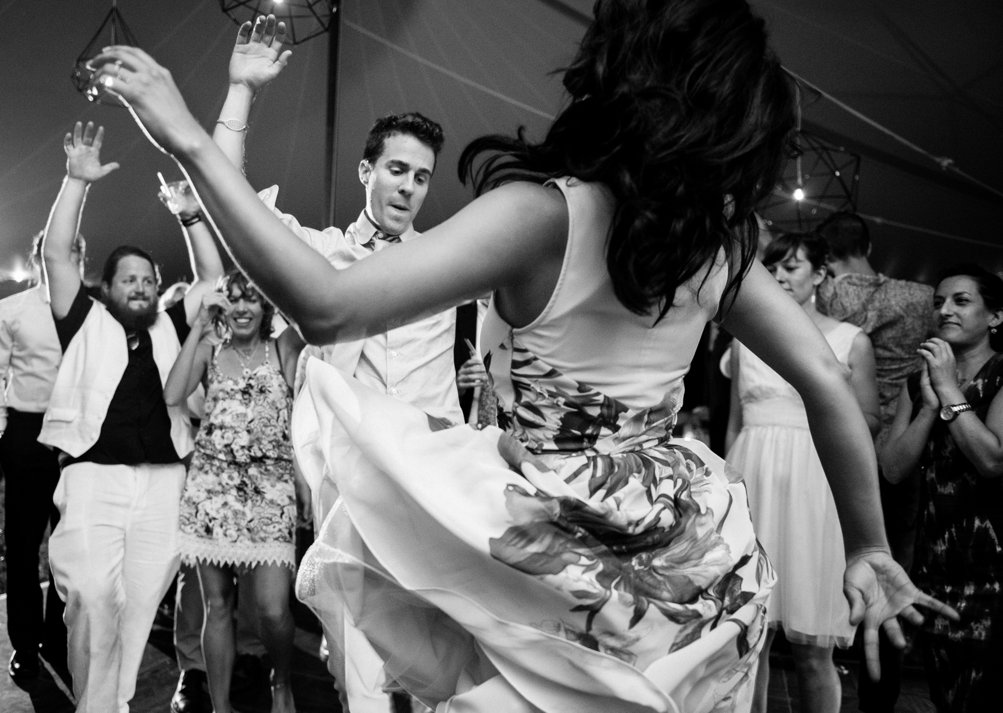 groom dancing during his tented wedding reception in asheville