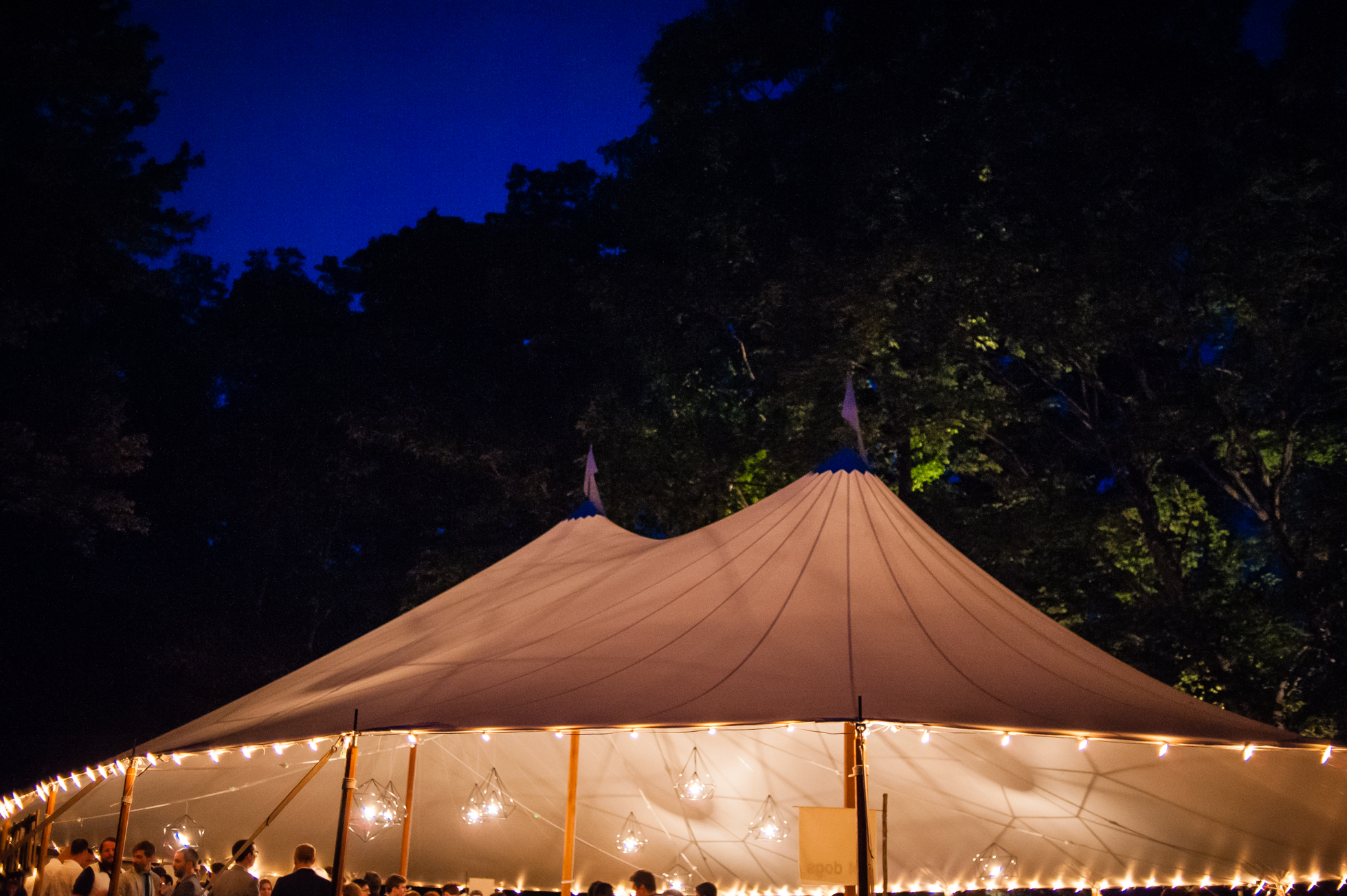 gorgeous sailcloth tent lit up at night 