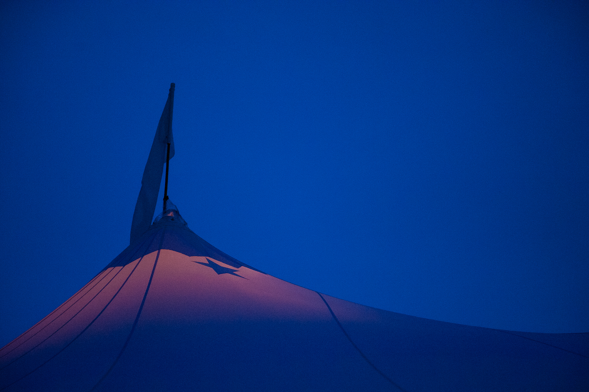 gorgeous tent with star lit up at night during luxury destination wedding 