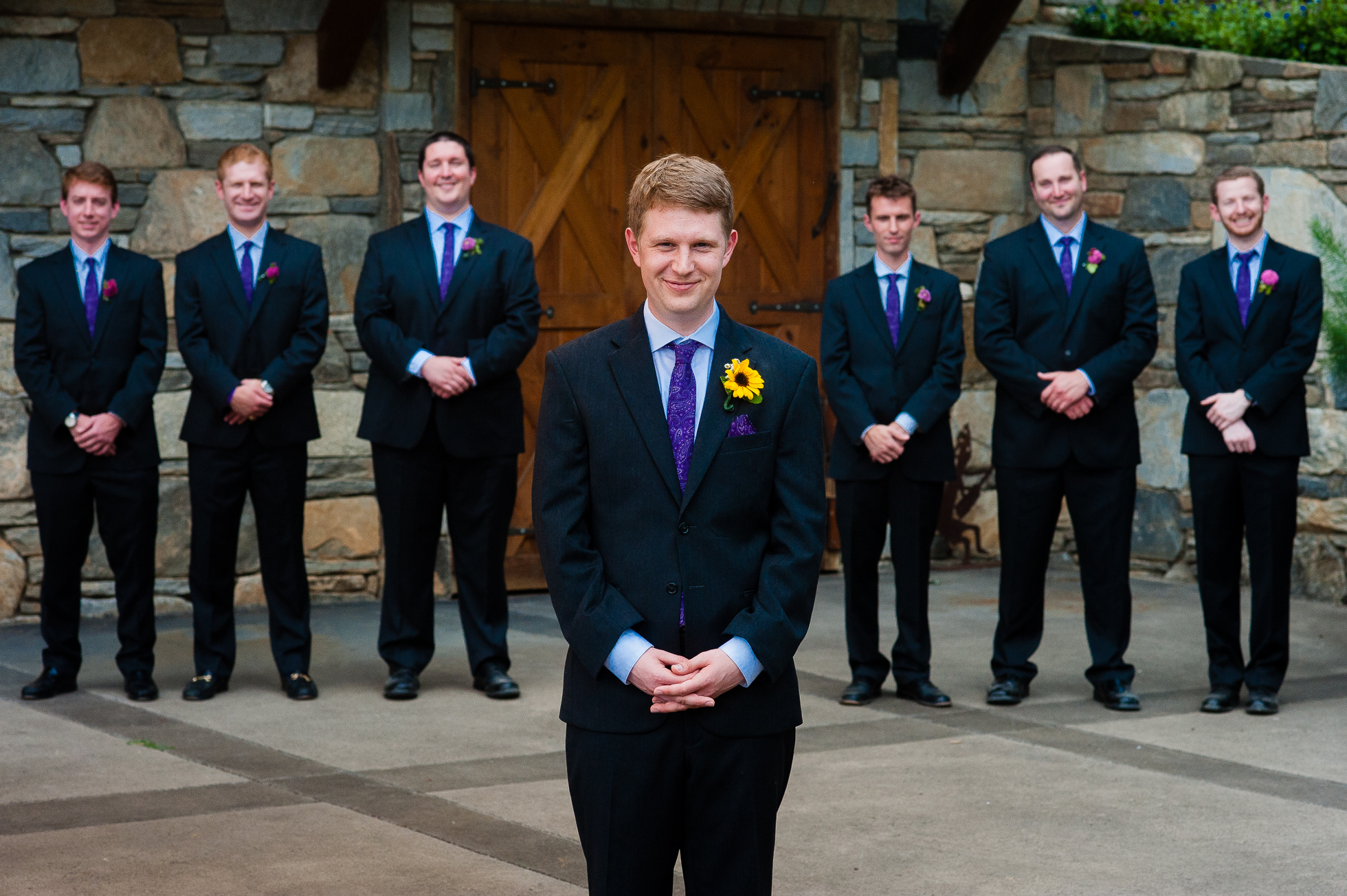 groom and groomsmen pose for portrait at asheville wedding