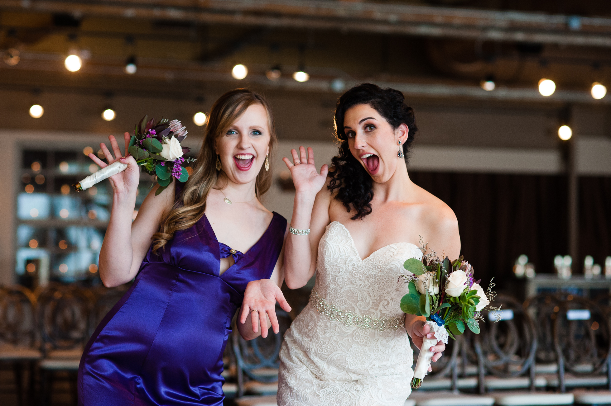 bride and bridesmaid being goofy during asheville wedding 