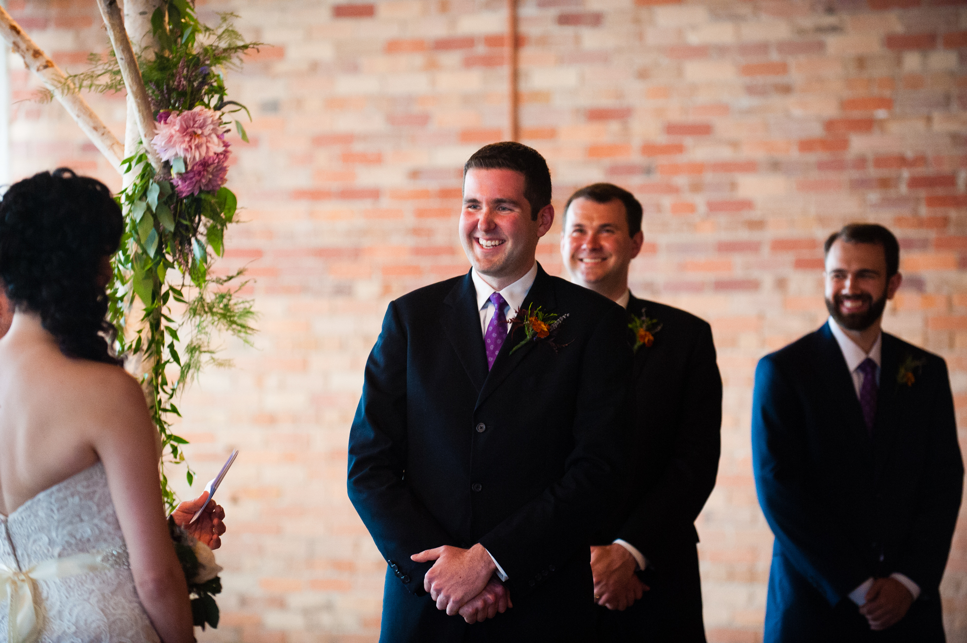 handsome groom smiling during asheville wedding ceremony