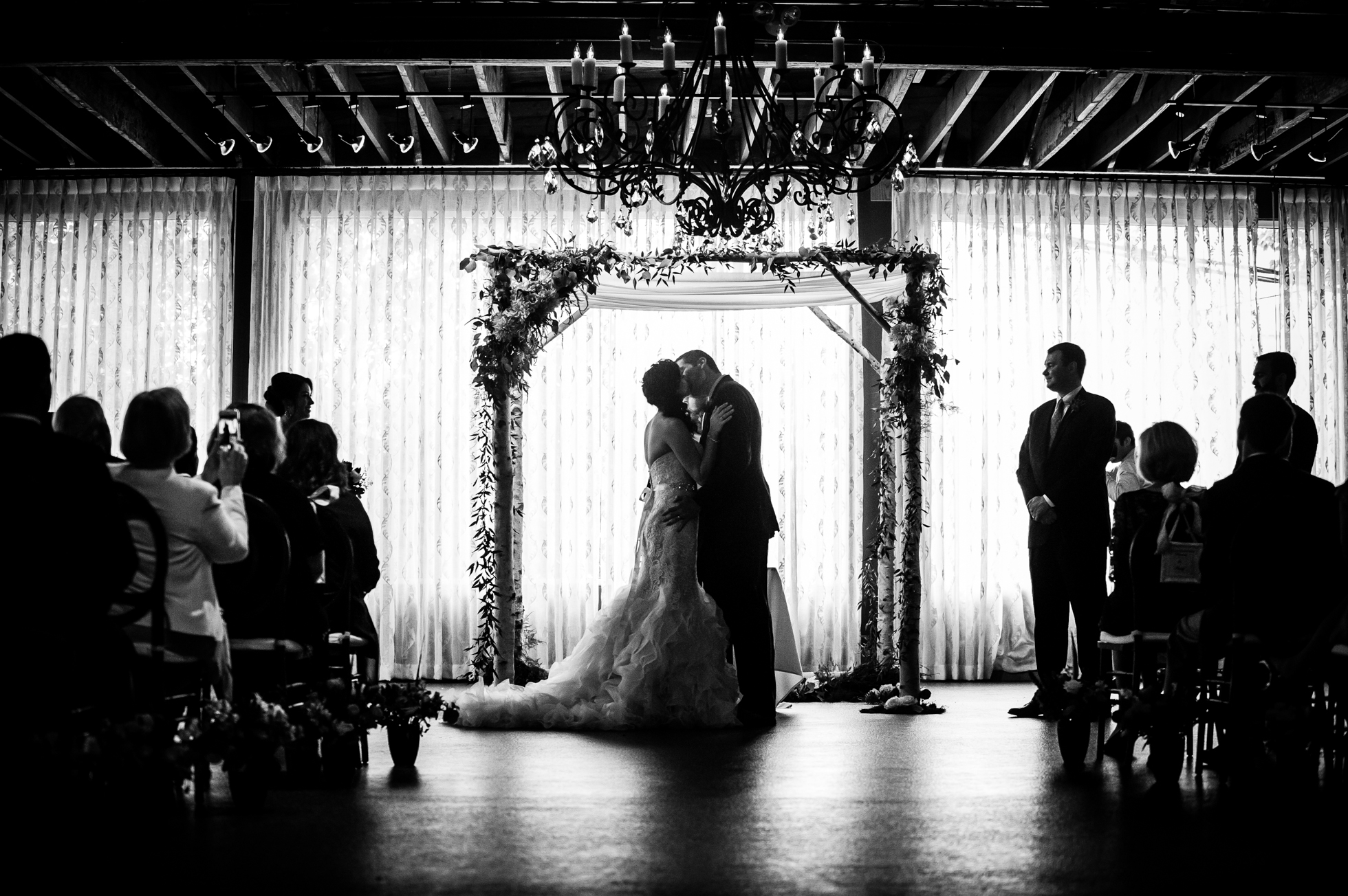 first kiss during asheville wedding ceremony at the venue