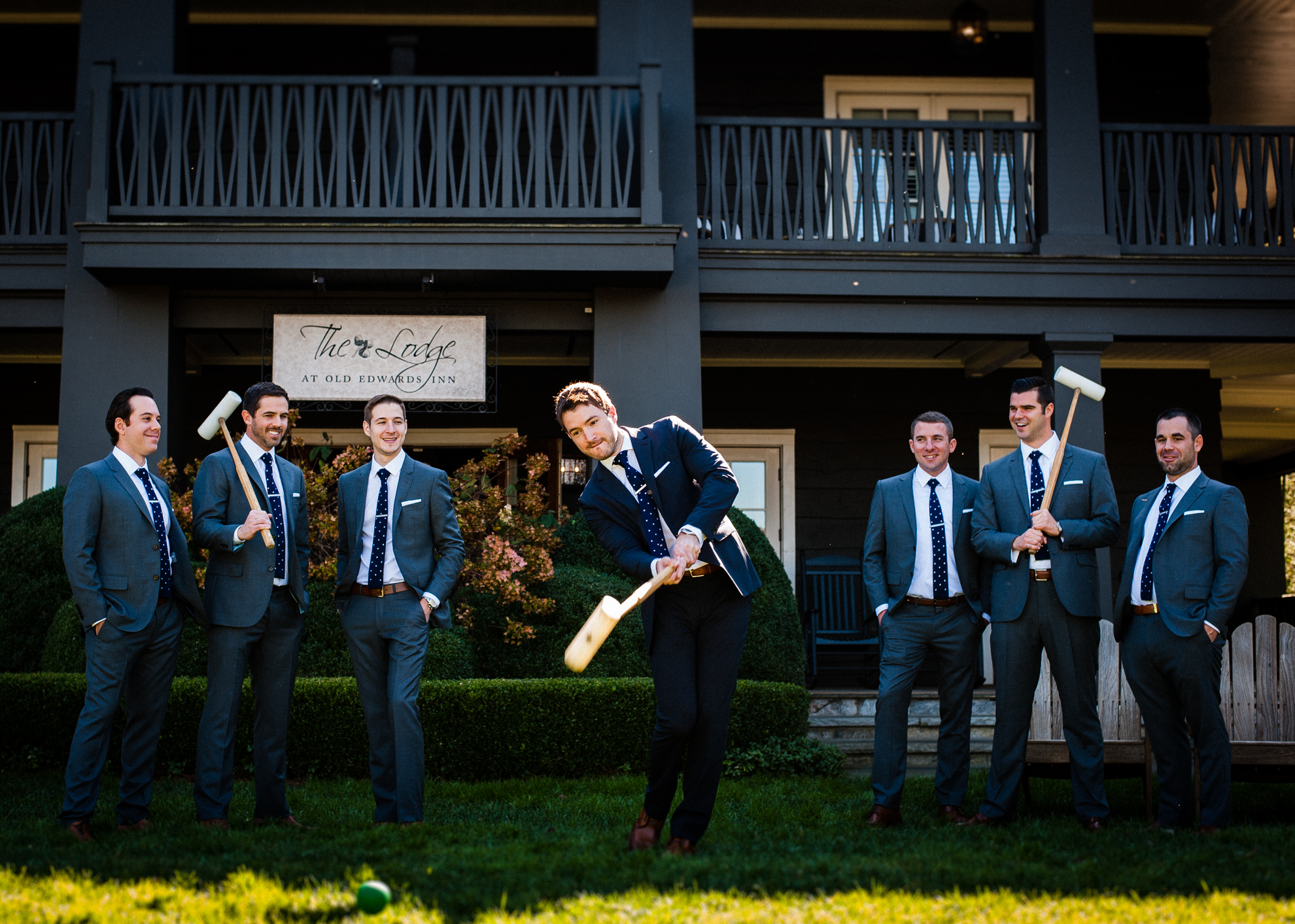 groom and groomsmen play croquet at old edwards inn wedding