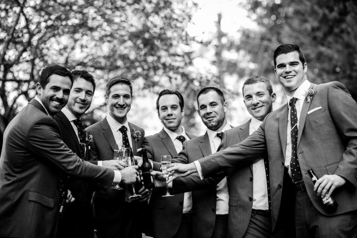 groomsmen celebrating post ceremony