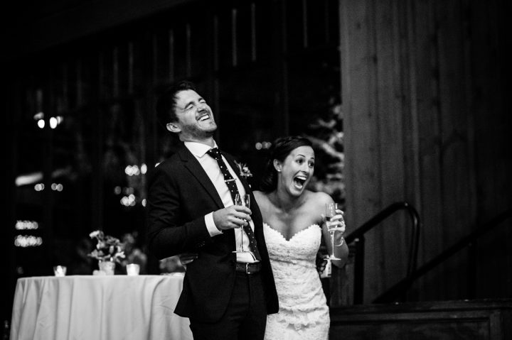 bride and groom laugh at wedding toasts