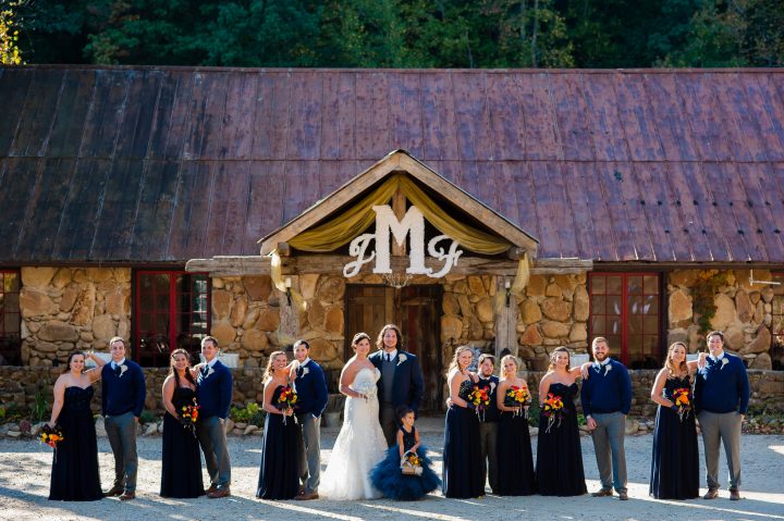 wedding party in front of brown mountain beach lodge 