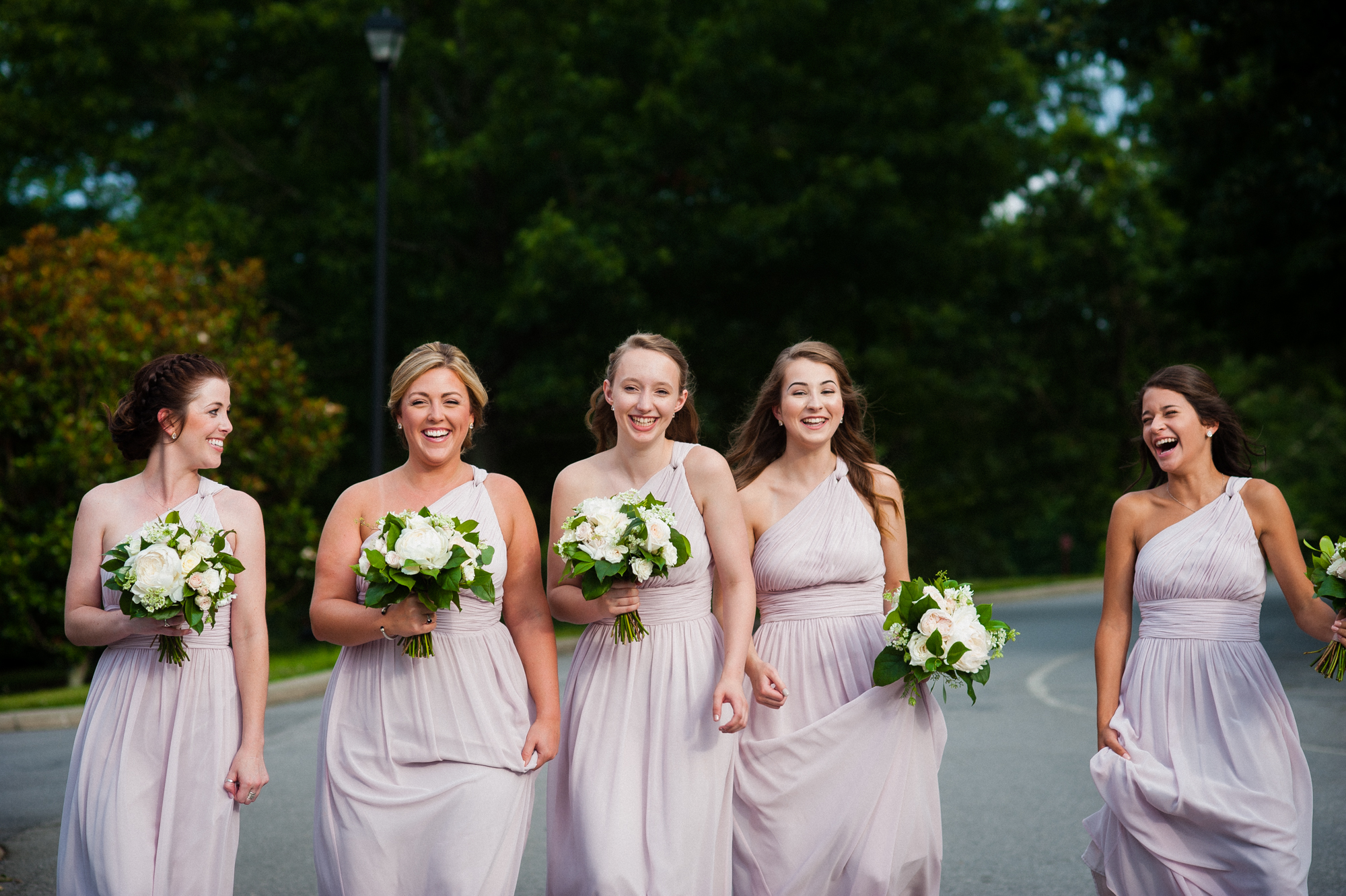 candid image of bridesmaids walking 