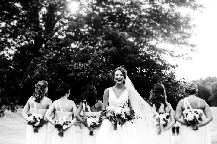 Bride and bridesmaids with beautiful bouquets by Flora