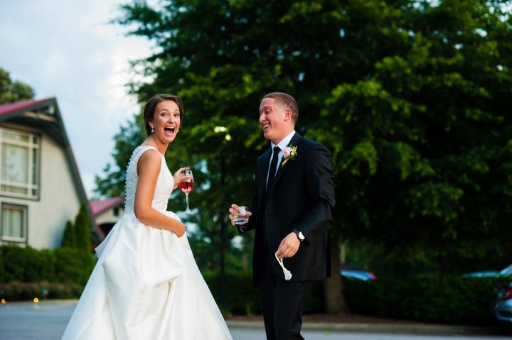 bride and groom laughing together on their wedding day 