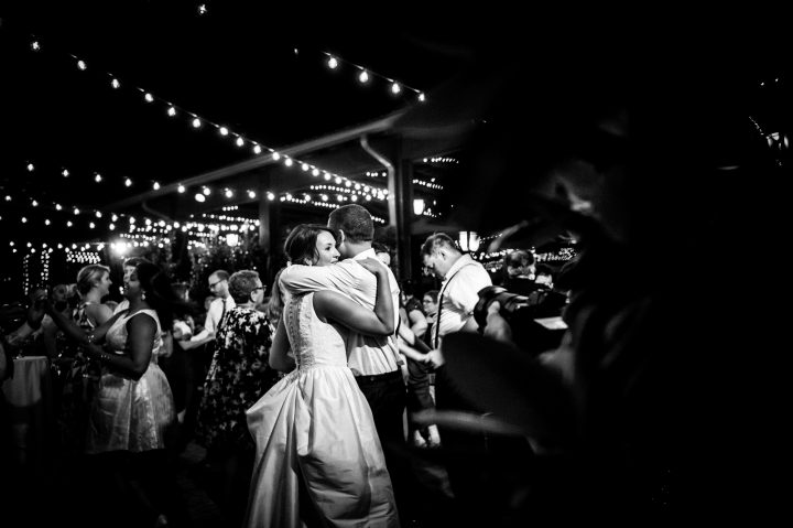 bride and groom dance in courtyard of lioncrest